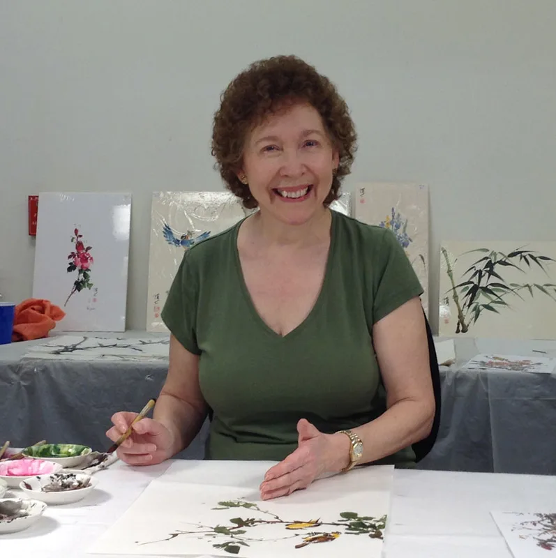 Picture of artist painting birds