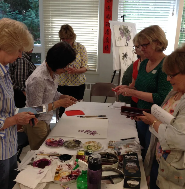 Picture of Sumie Society members photographing Virginia's demonstrations