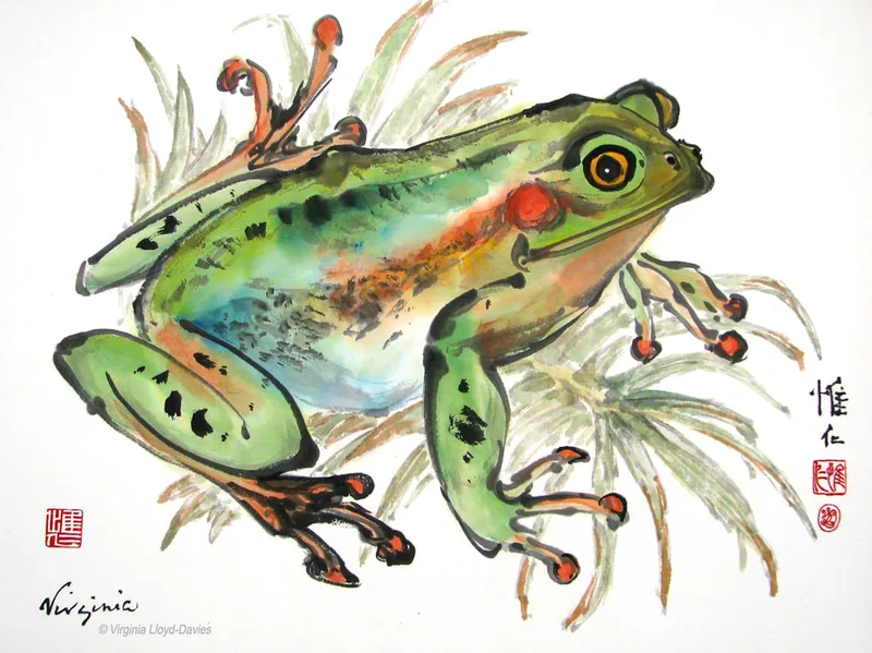Green and red frog on green frond
