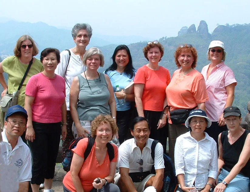 I-Hsiung's students standing in front of mountain backdrop