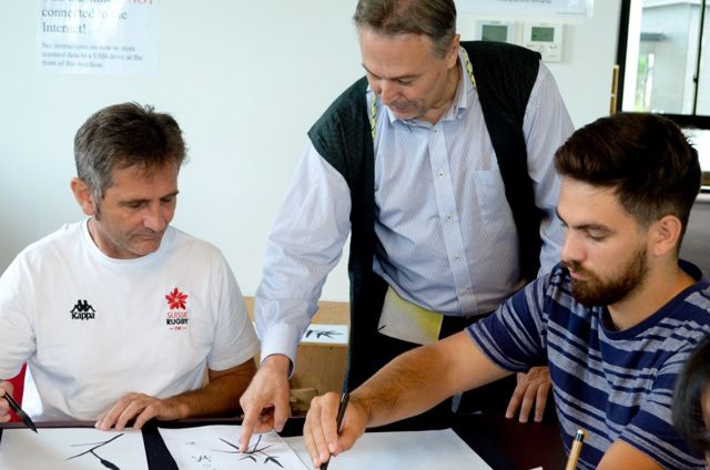 Picture of 3 men in classroom