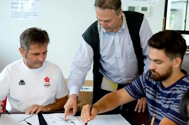 Picture of 3 men in classroom