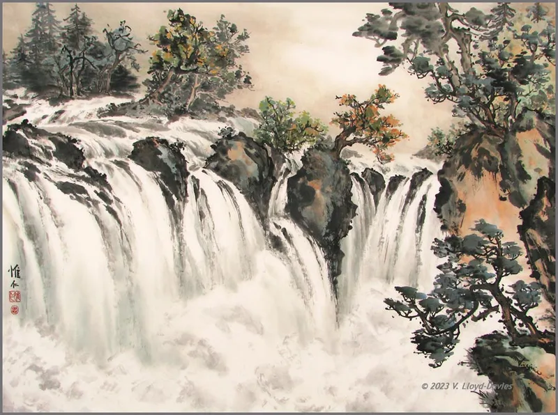 Large waterfall surrounded by trees and cliffs