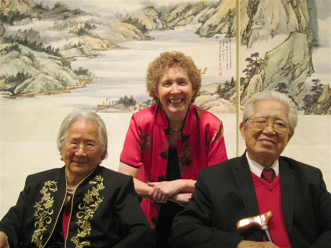 Ju and Virginia Lloyd-Davies in front of Yantze River scroll Picture